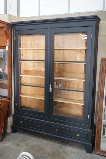 A French painted glazed pine two door bookcase, width 155cm, depth 27cm, height 211cm